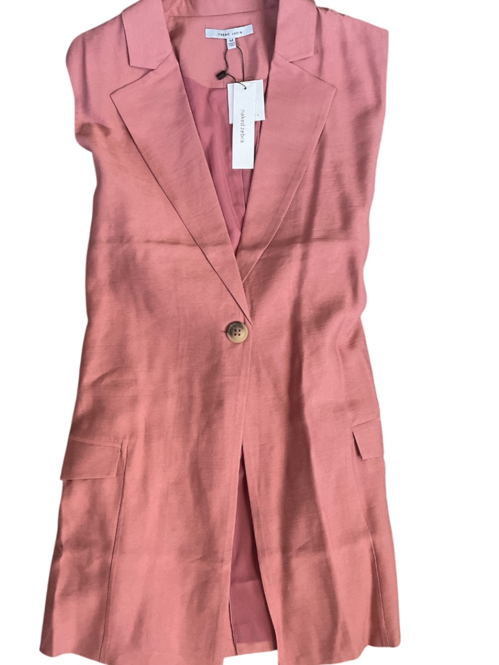 Naked Zebra pink sleeveless blazer vest with a single button closure.